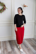 Model showcasing  Nuggles® midi tee skirts in various solid colors, modest 27" and 31" lengths