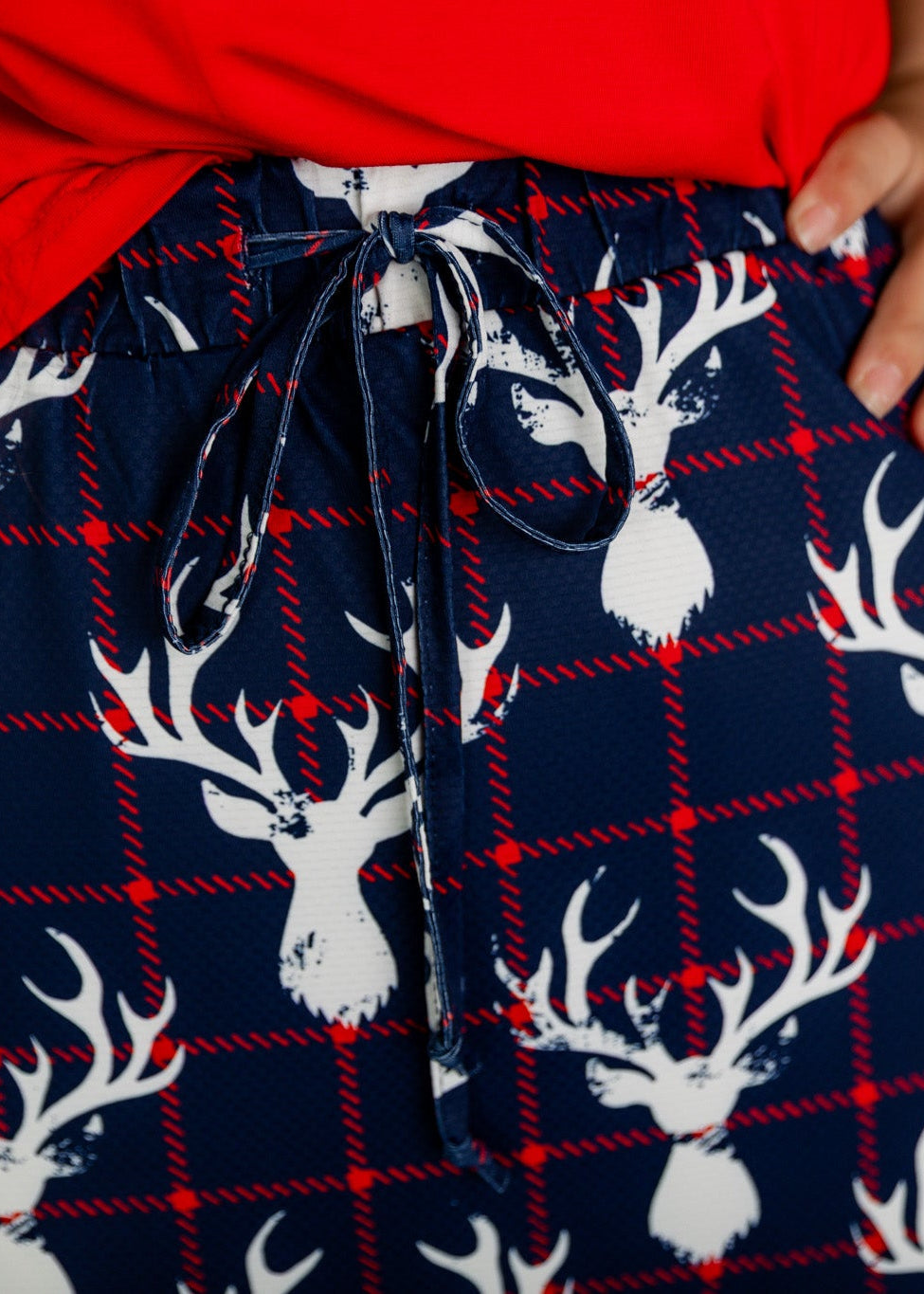 Model wearing Nuggles® 27 inch Sport Flex Skirt with pockets and drawstring waistband