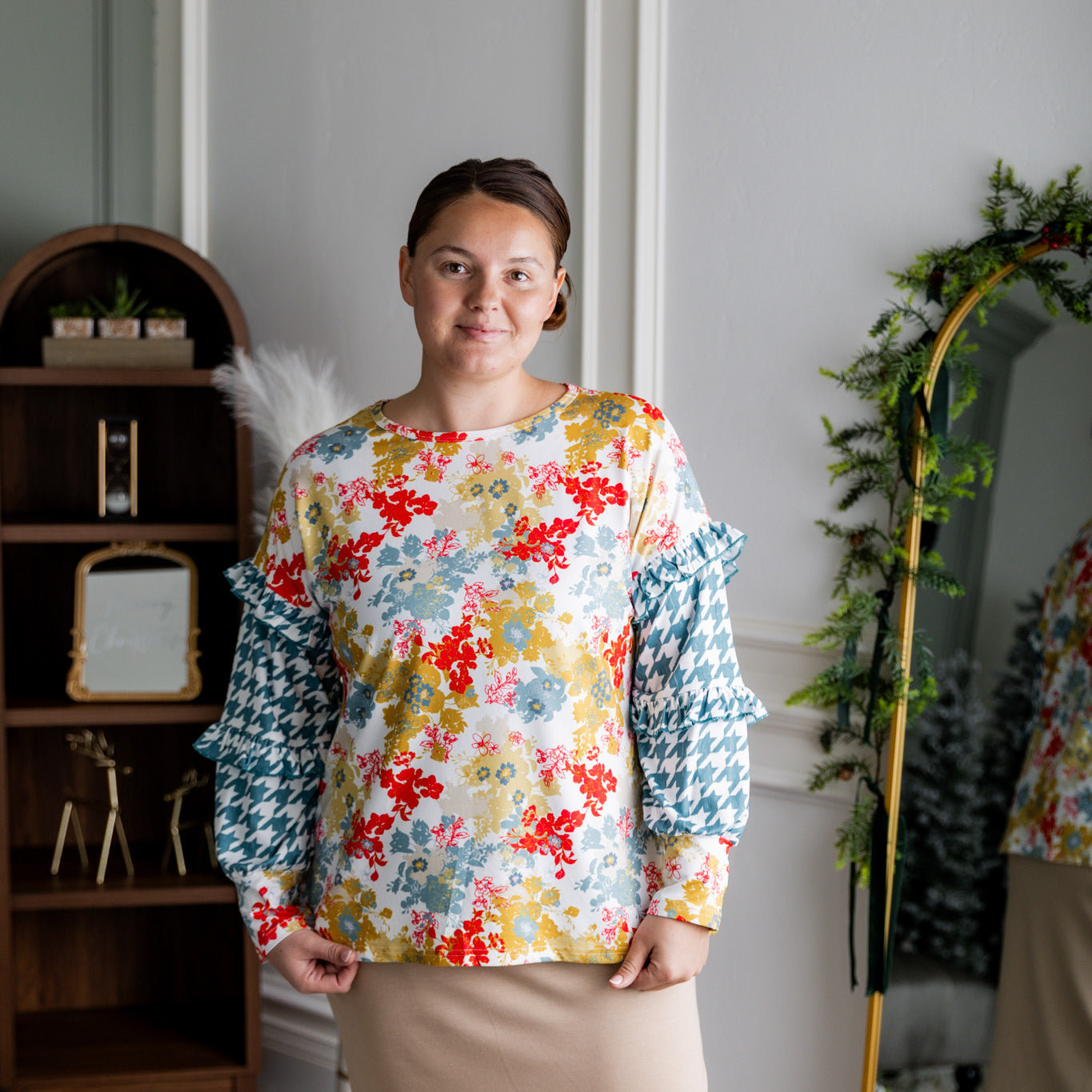 Nuggles® Rilynn Top – modest women’s printed top with ruffled sleeves and relaxed fit.