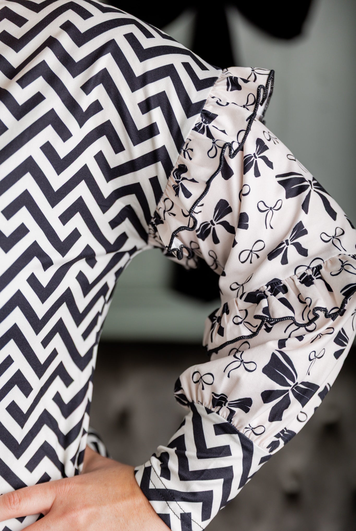 Nuggles® Rilynn Top – modest women’s printed top with ruffled sleeves and relaxed fit.