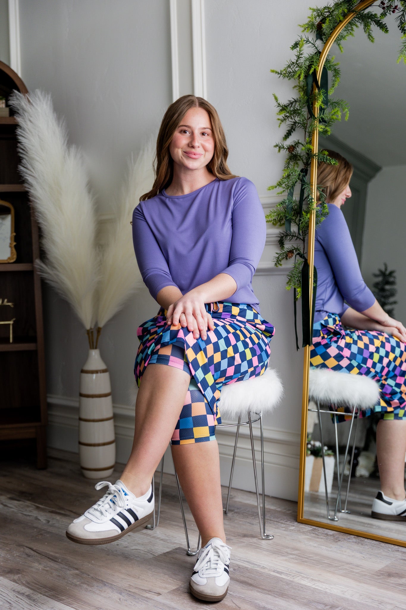 Model wearing Nuggles® 27 inch Sport Flex Skirt with pockets and drawstring waistband