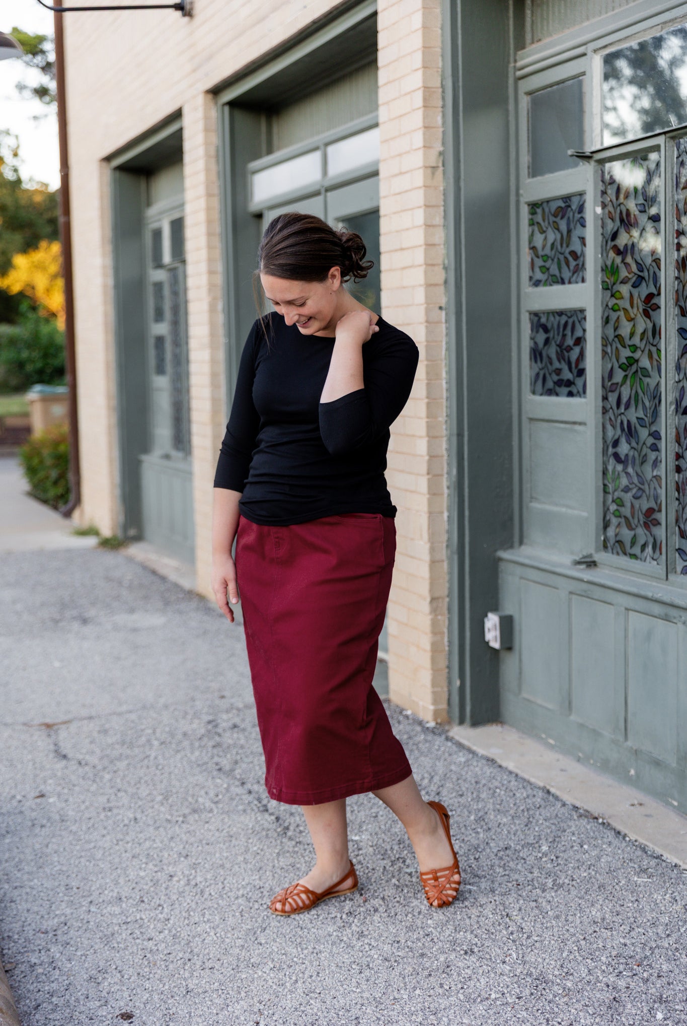 Nuggles® denim midi skirt with soft stretch fabric, wide elastic waistband, modest length, and functional pockets. Available in 27", 31", and 34" lengths.