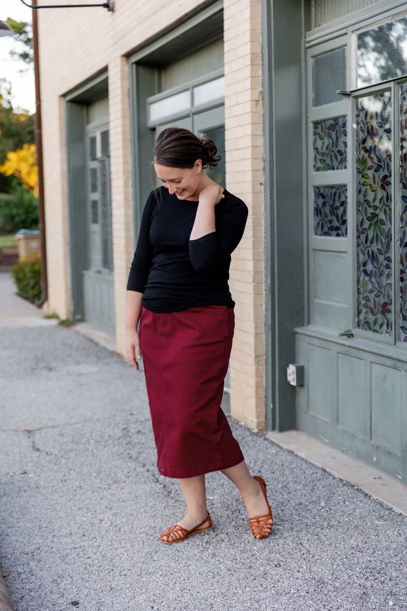 Nuggles® denim midi skirt with soft stretch fabric, wide elastic waistband, modest length, and functional pockets. Available in 27", 31", and 34" lengths.