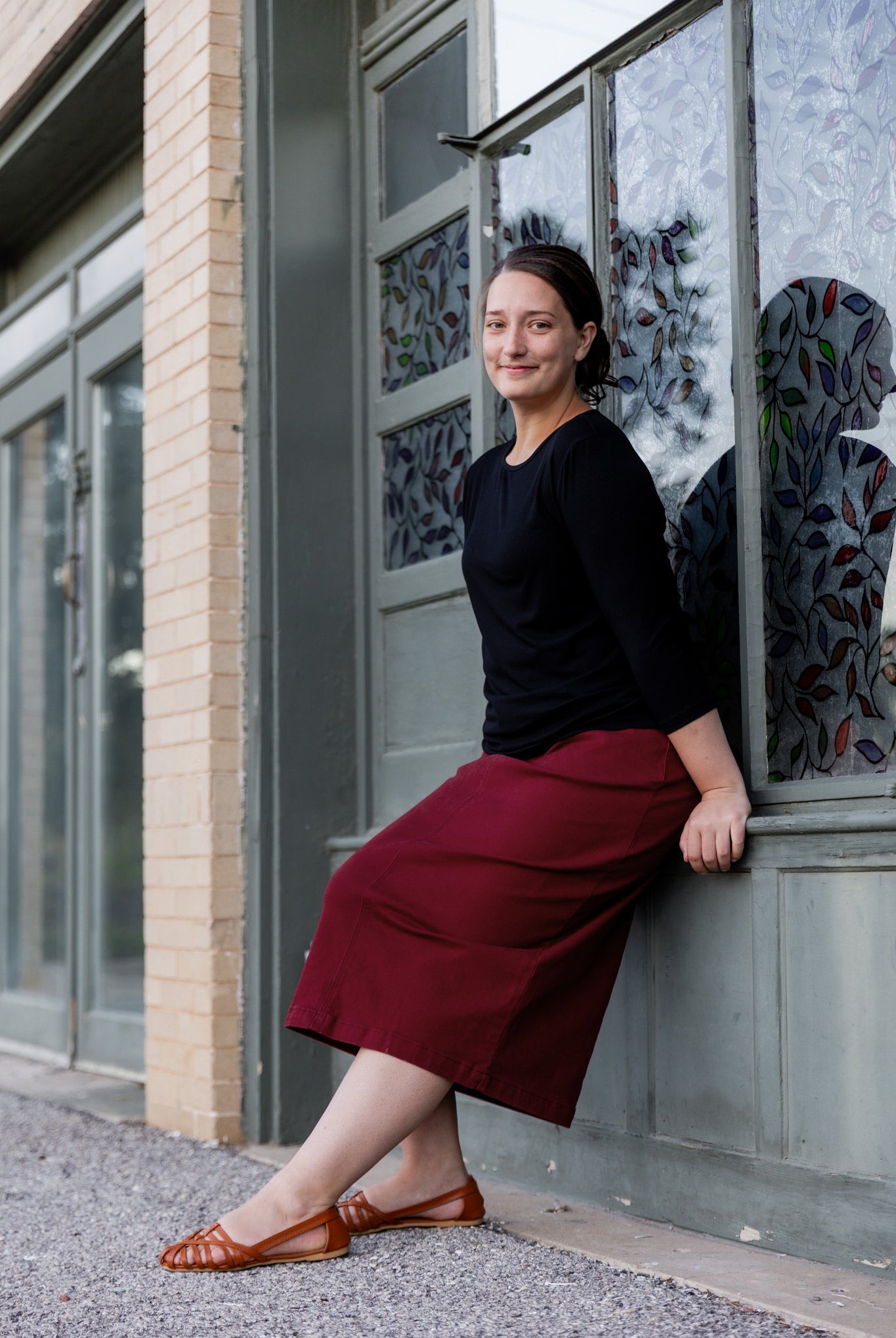 Nuggles® denim midi skirt with soft stretch fabric, wide elastic waistband, modest length, and functional pockets. Available in 27", 31", and 34" lengths.