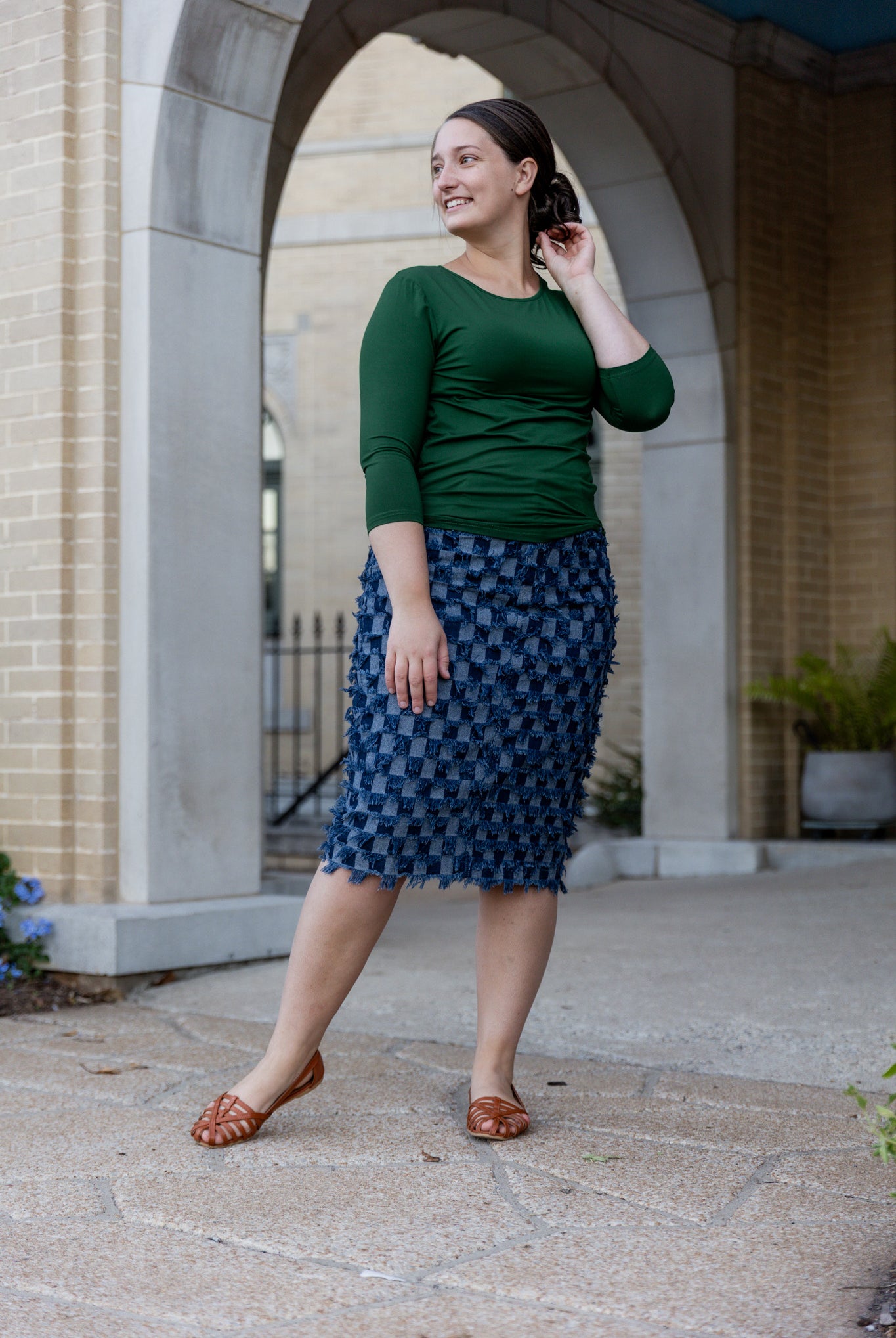 Nuggles® denim midi skirt with soft stretch fabric, wide elastic waistband, modest length, and functional pockets. Available in 27", 31", and 34" lengths.