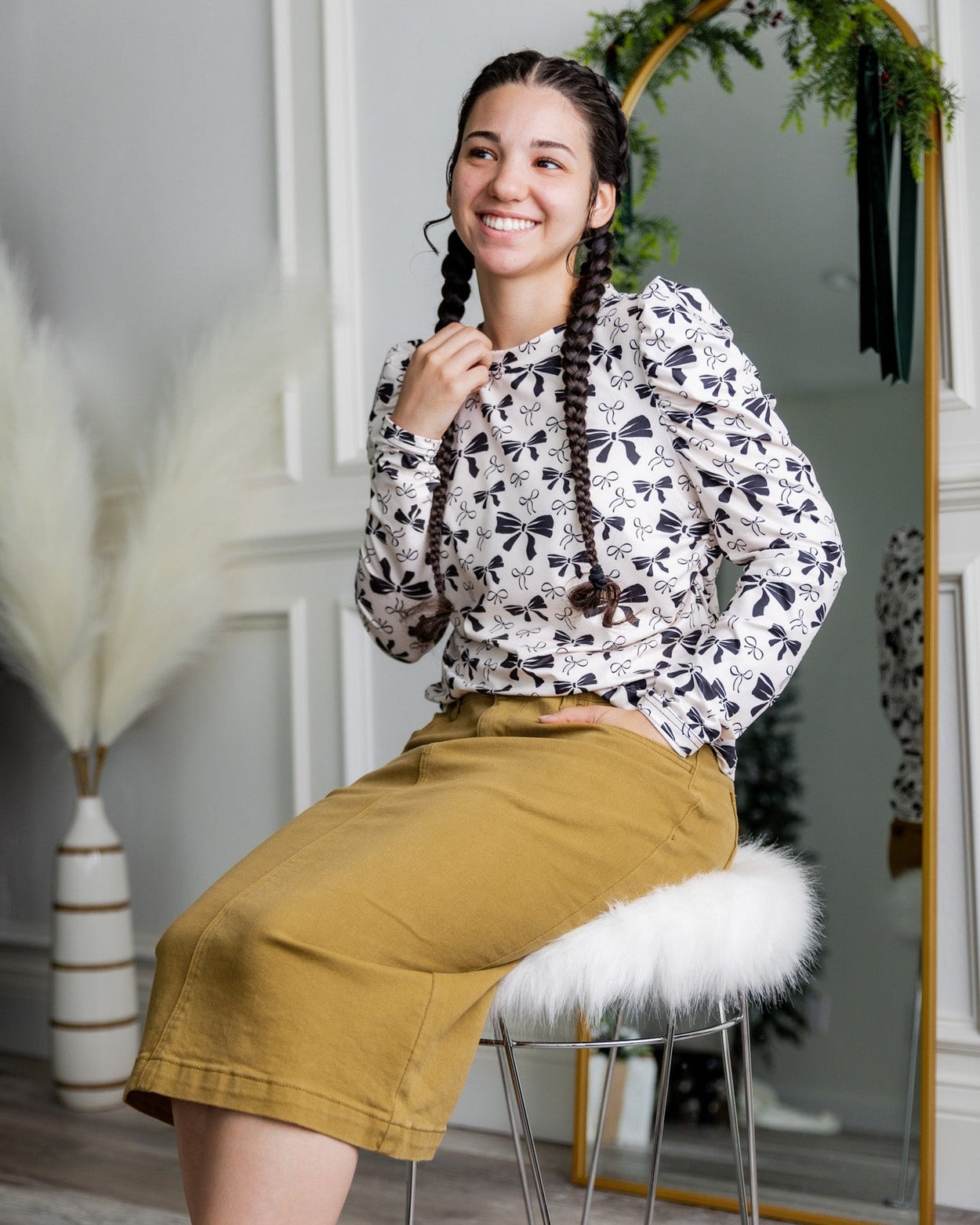 Nuggles® denim midi skirt with soft stretch fabric, wide elastic waistband, modest length, and functional pockets. Available in 27", 31", and 34" lengths.