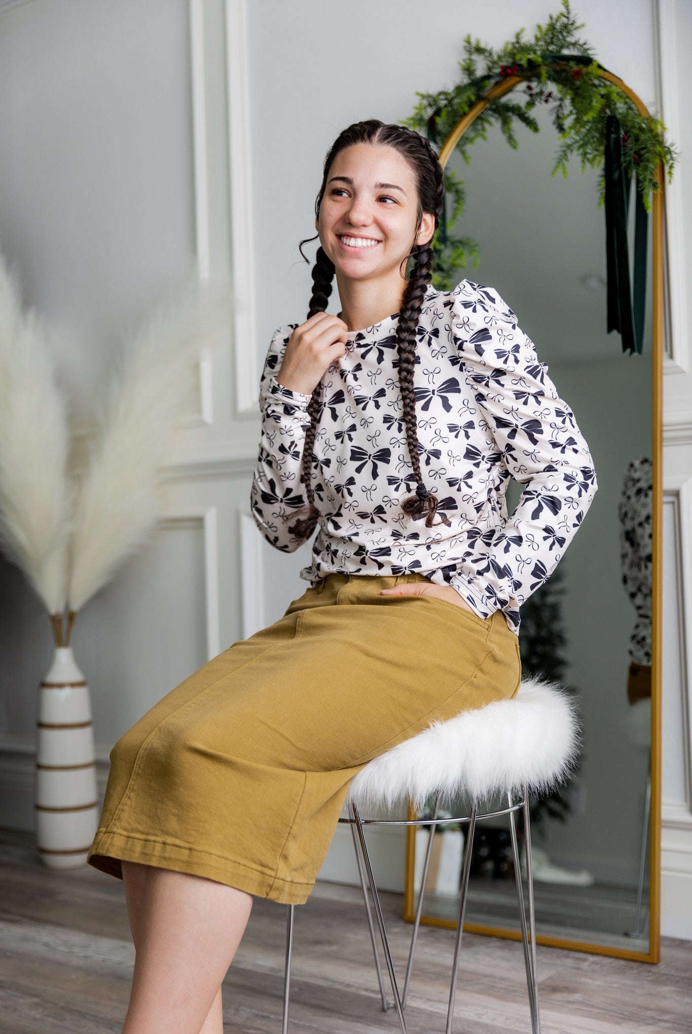 Nuggles® denim midi skirt with soft stretch fabric, wide elastic waistband, modest length, and functional pockets. Available in 27", 31", and 34" lengths.