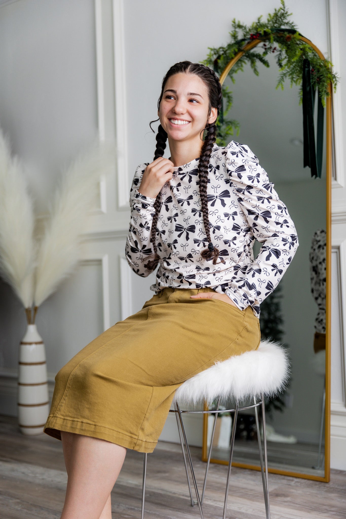 Nuggles® denim midi skirt with soft stretch fabric, wide elastic waistband, modest length, and functional pockets. Available in 27", 31", and 34" lengths.