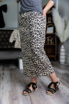 Nuggles® denim midi skirt with soft stretch fabric, wide elastic waistband, modest length, and functional pockets. Available in 27", 31", and 34" lengths.