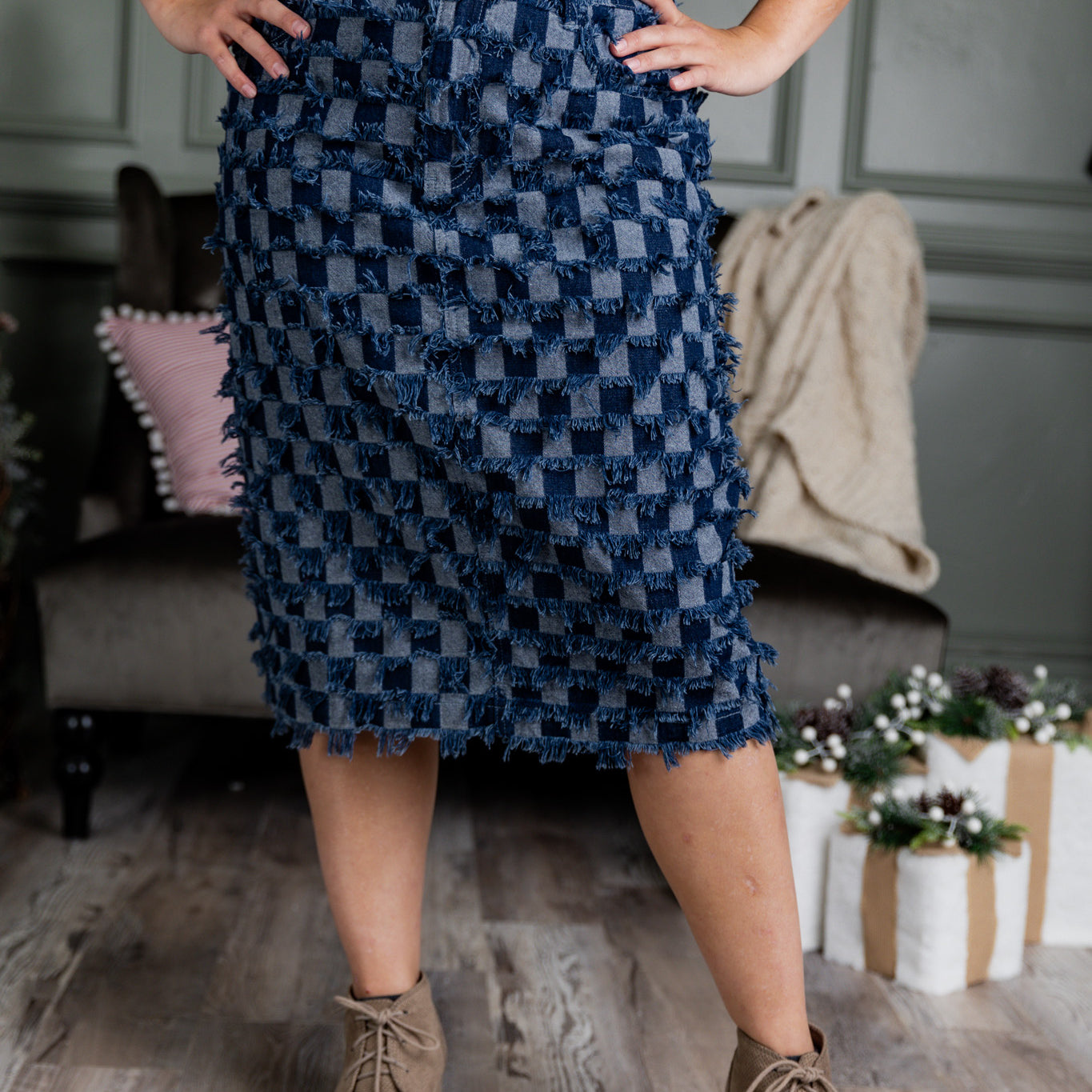 Nuggles® denim midi skirt with soft stretch fabric, wide elastic waistband, modest length, and functional pockets. Available in 27", 31", and 34" lengths.