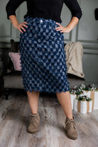 Nuggles® denim midi skirt with soft stretch fabric, wide elastic waistband, modest length, and functional pockets. Available in 27", 31", and 34" lengths.