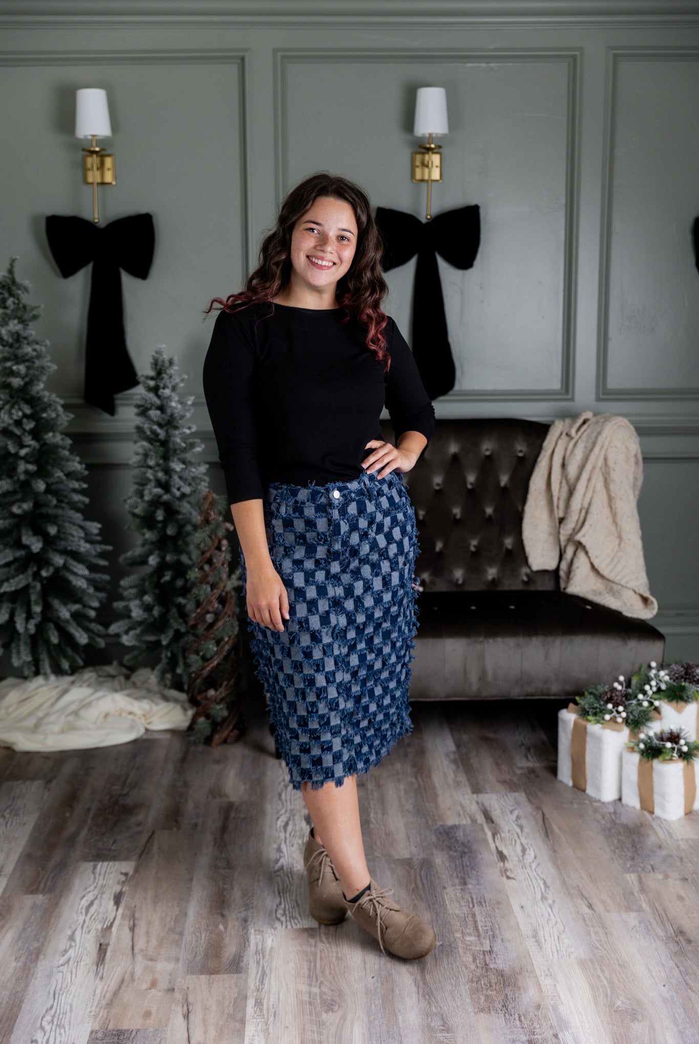 Nuggles® denim midi skirt with soft stretch fabric, wide elastic waistband, modest length, and functional pockets. Available in 27", 31", and 34" lengths.