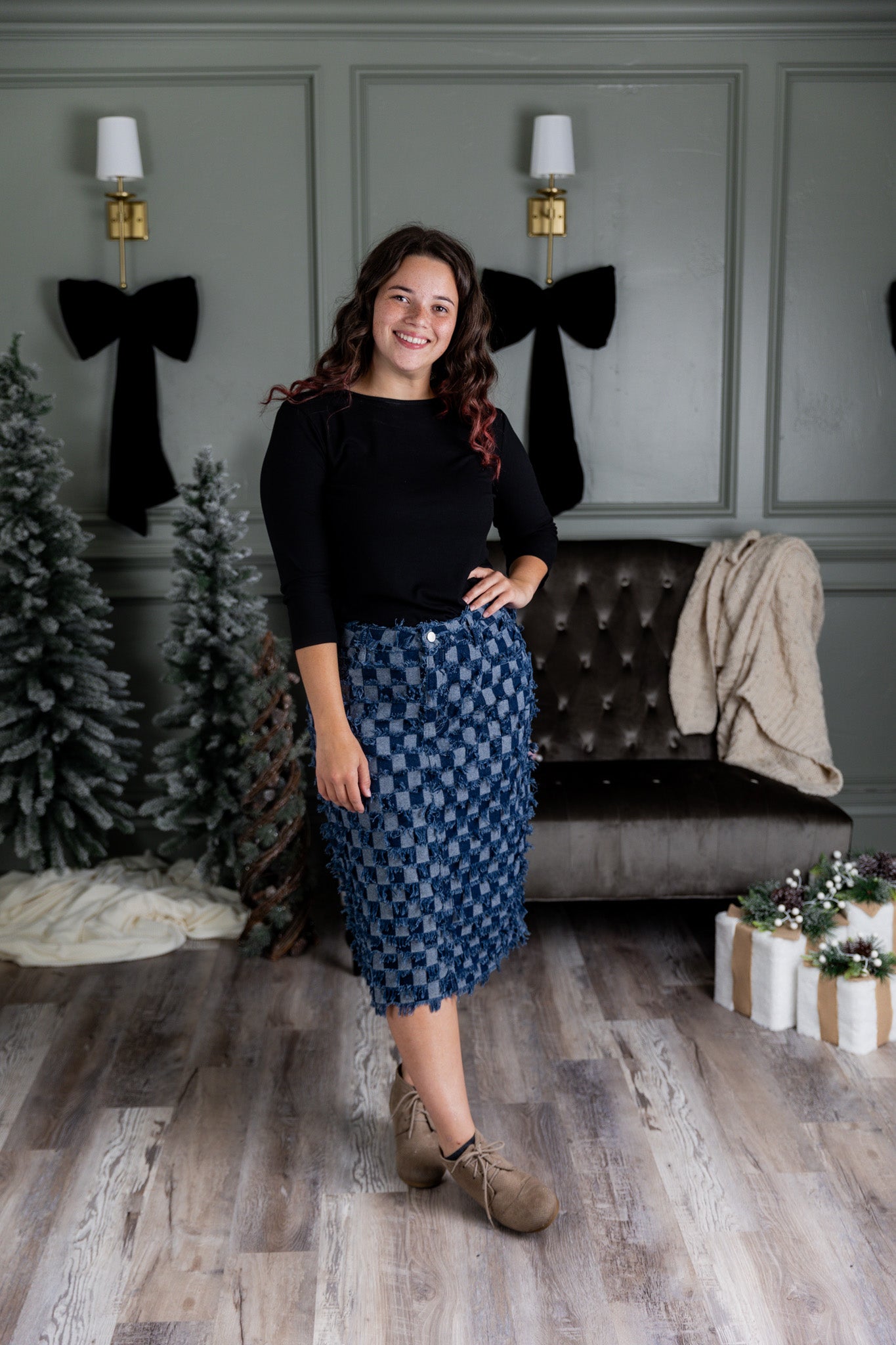 Nuggles® denim midi skirt with soft stretch fabric, wide elastic waistband, modest length, and functional pockets. Available in 27", 31", and 34" lengths.