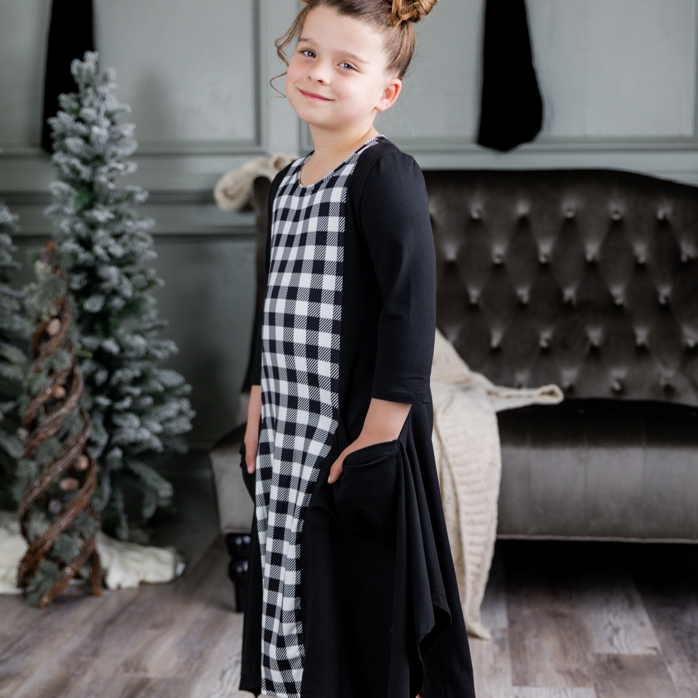 Nuggles® Raegan girls’ dress demonstrated on young model for product listing.