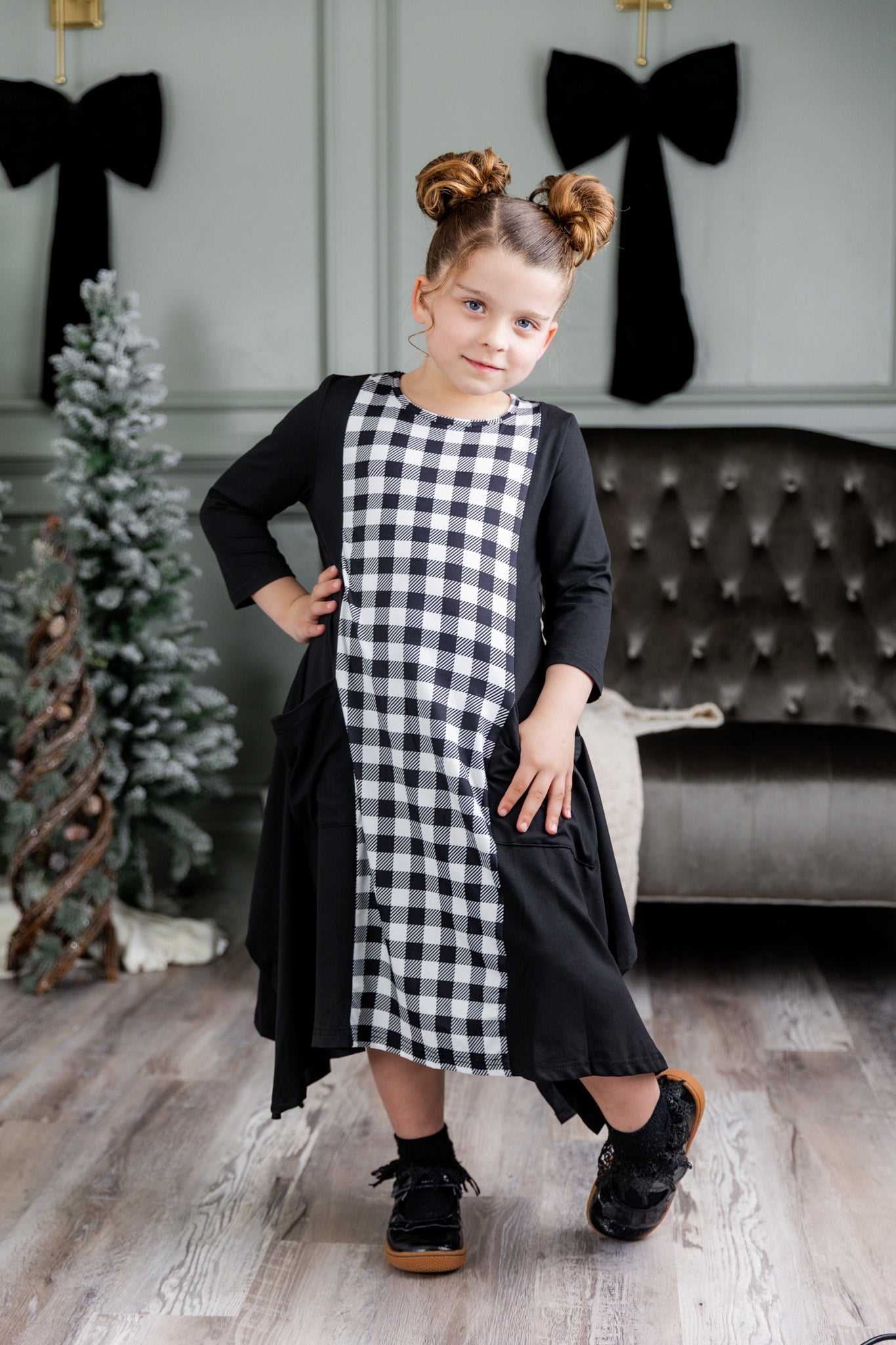 Nuggles® Raegan girls’ dress demonstrated on young model for product listing.