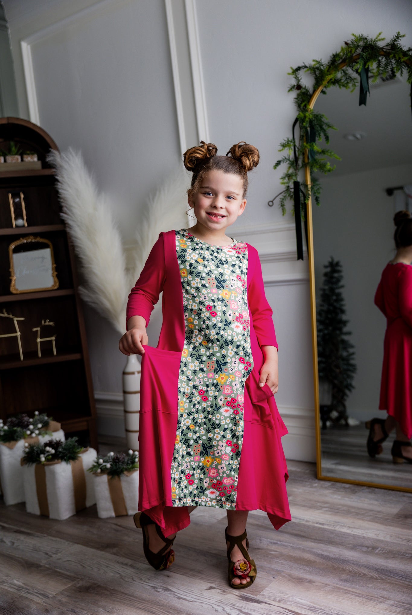 Nuggles® Raegan girls’ dress demonstrated on young model for product listing.