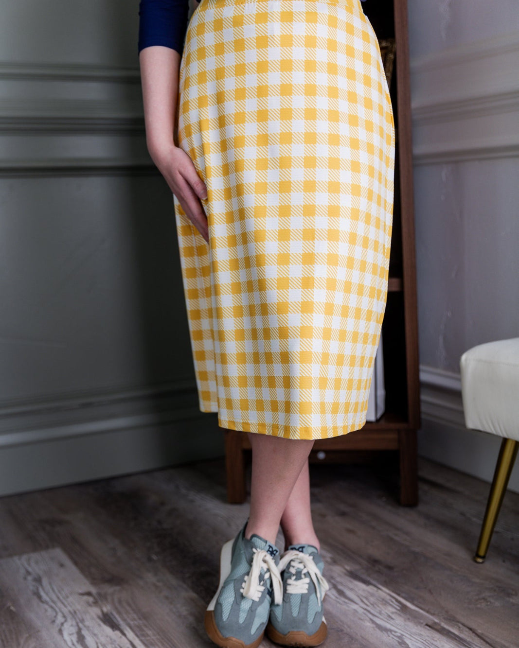 Model wearing the Nuggles® 27" All-Sport Skirt in Sunshine Check