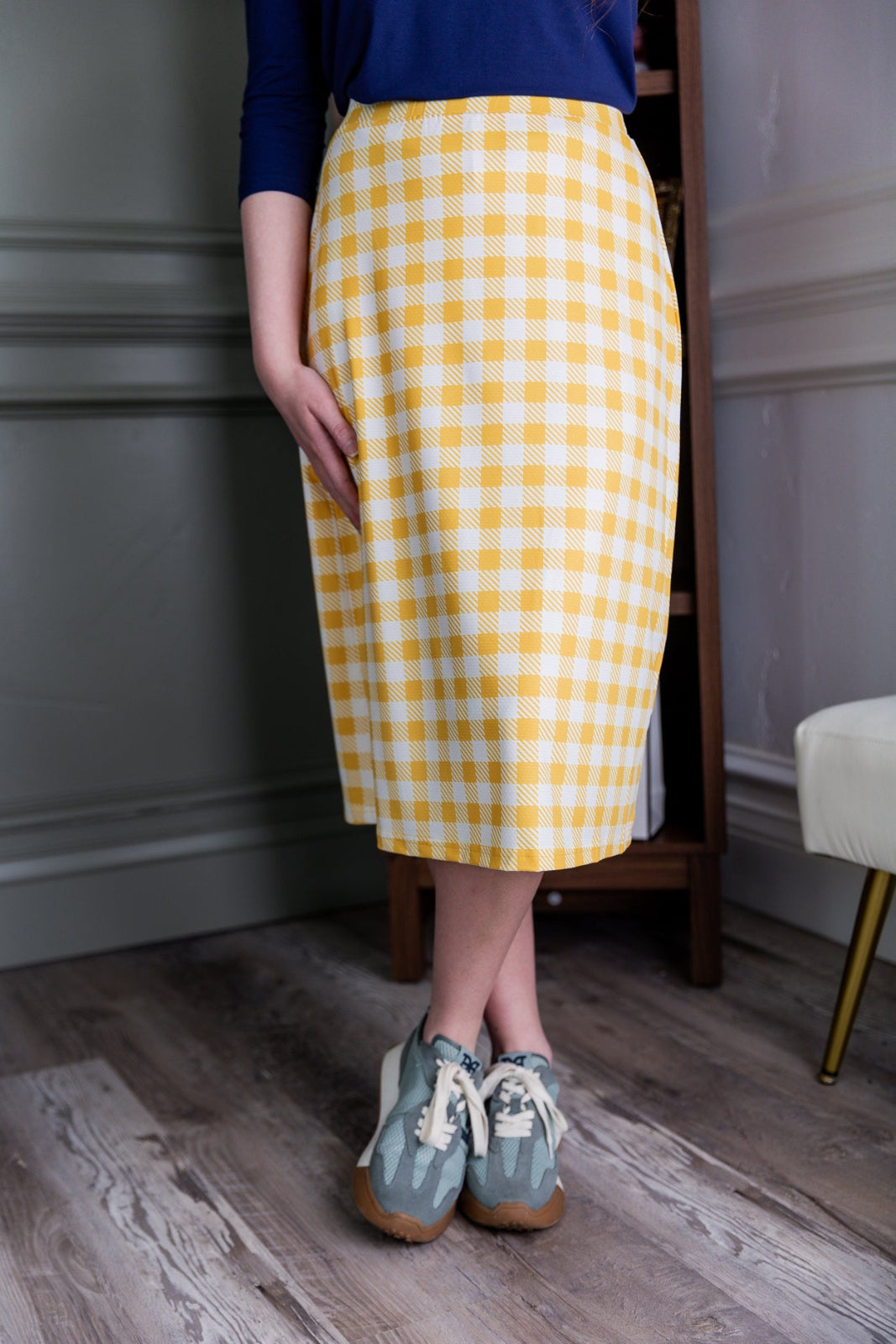 Model wearing the Nuggles® 27" All-Sport Skirt in Sunshine Check