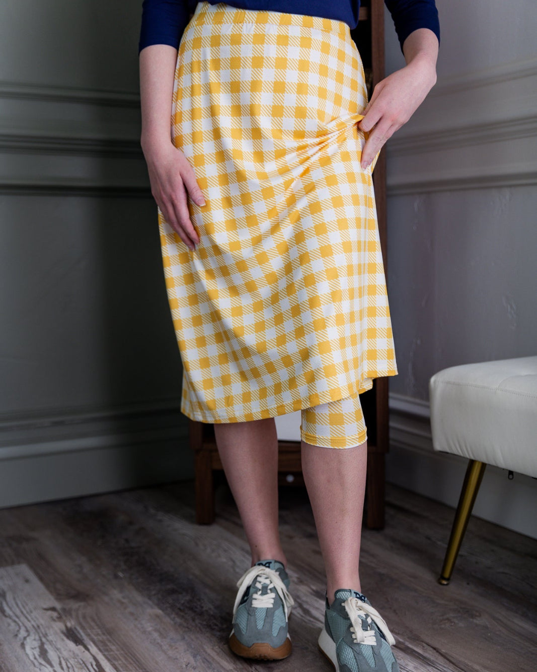 Model wearing the Nuggles® 27" All-Sport Skirt in Sunshine Check