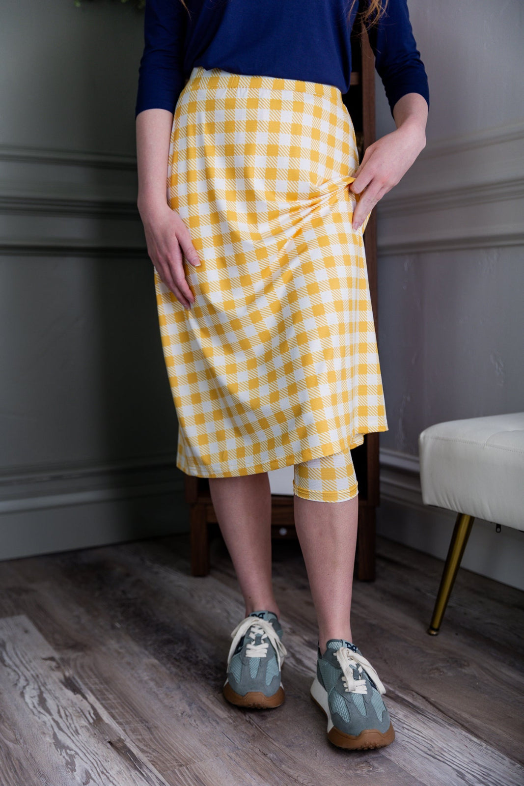 Model wearing the Nuggles® 27" All-Sport Skirt in Sunshine Check