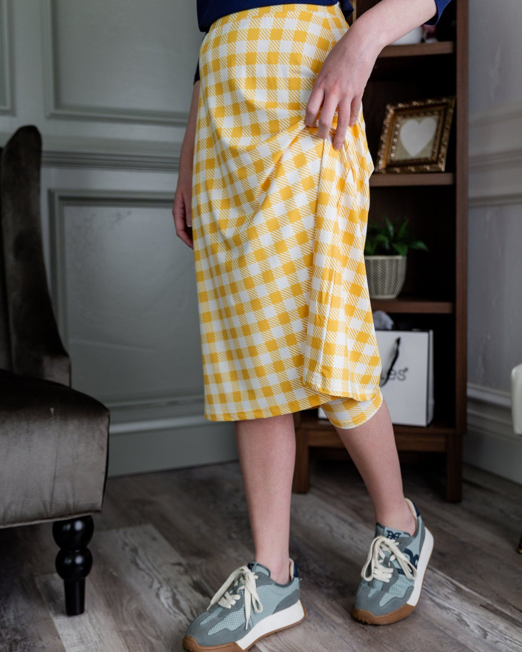 Model wearing the Nuggles® 27" All-Sport Skirt in Sunshine Check