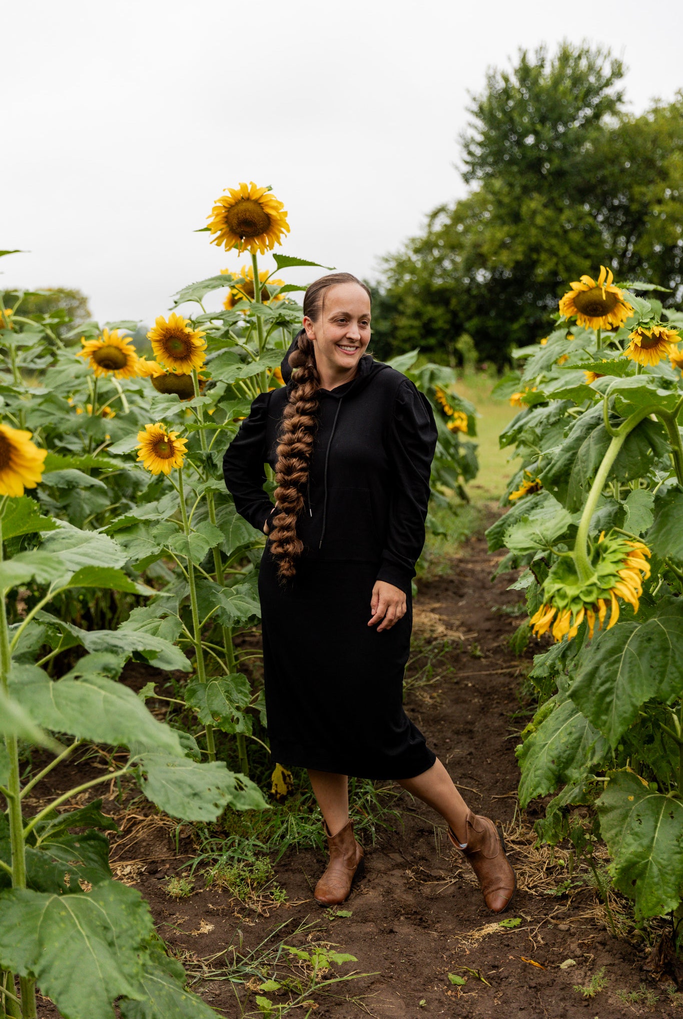 Model wearing Nuggles® Zoelle Dress in solid color, modest hoodie dress with puff sleeves.