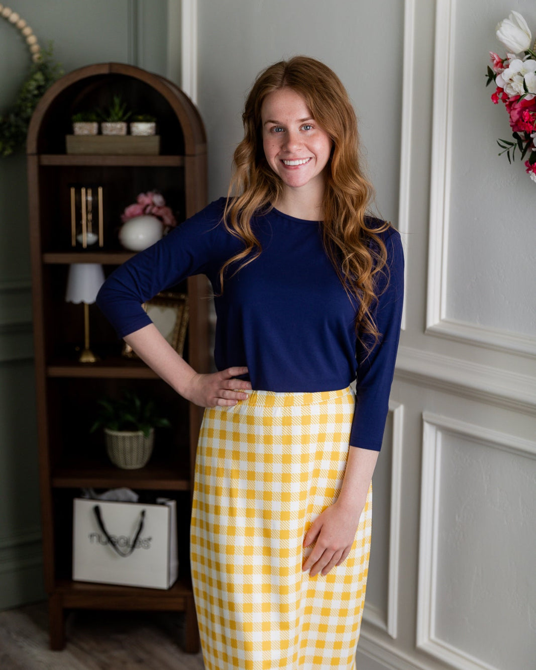 Model wearing the Nuggles® 27" All-Sport Skirt in Sunshine Check