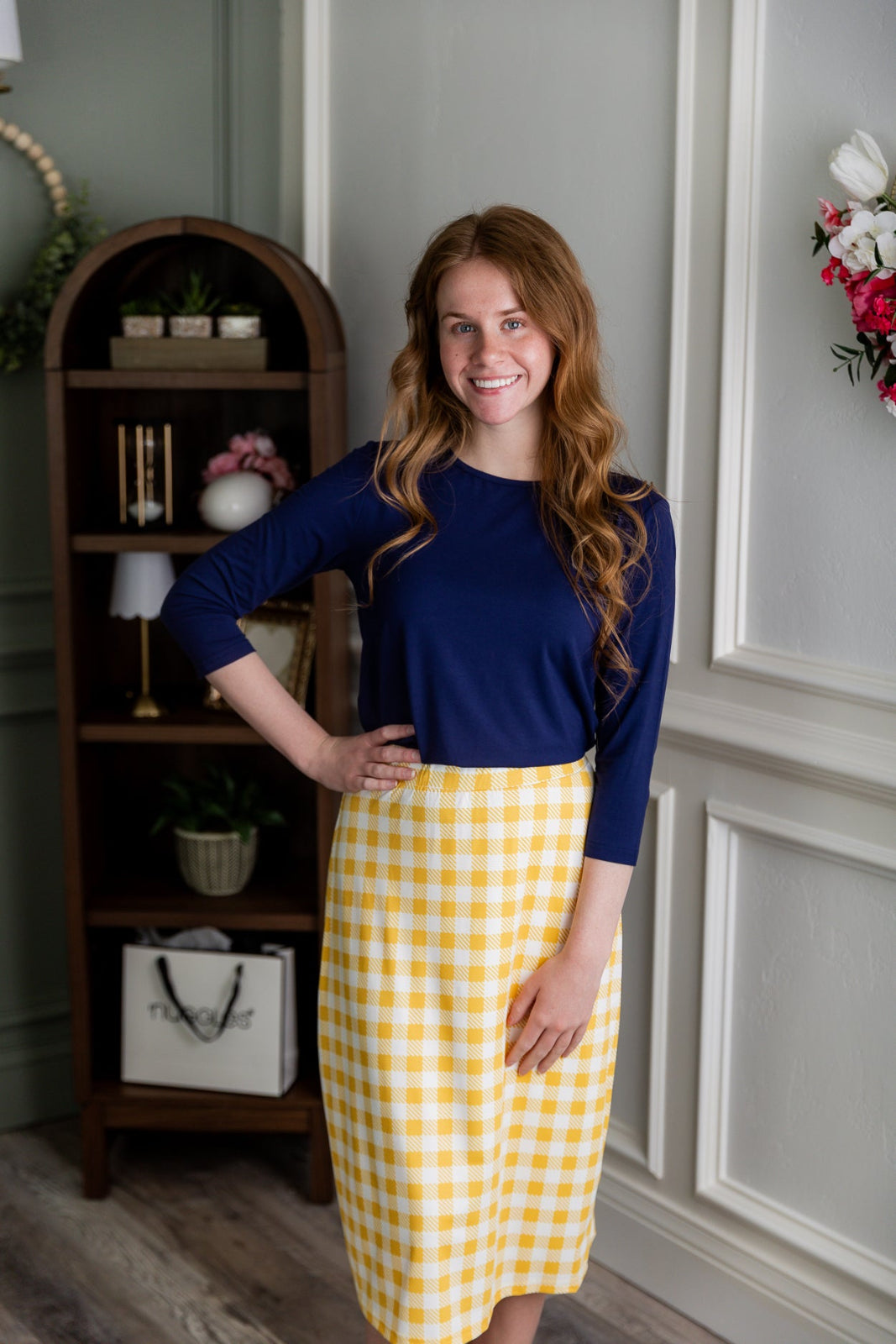 Model wearing the Nuggles® 27" All-Sport Skirt in Sunshine Check