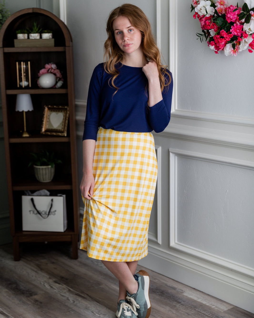 Model wearing the Nuggles® 27" All-Sport Skirt in Sunshine Check