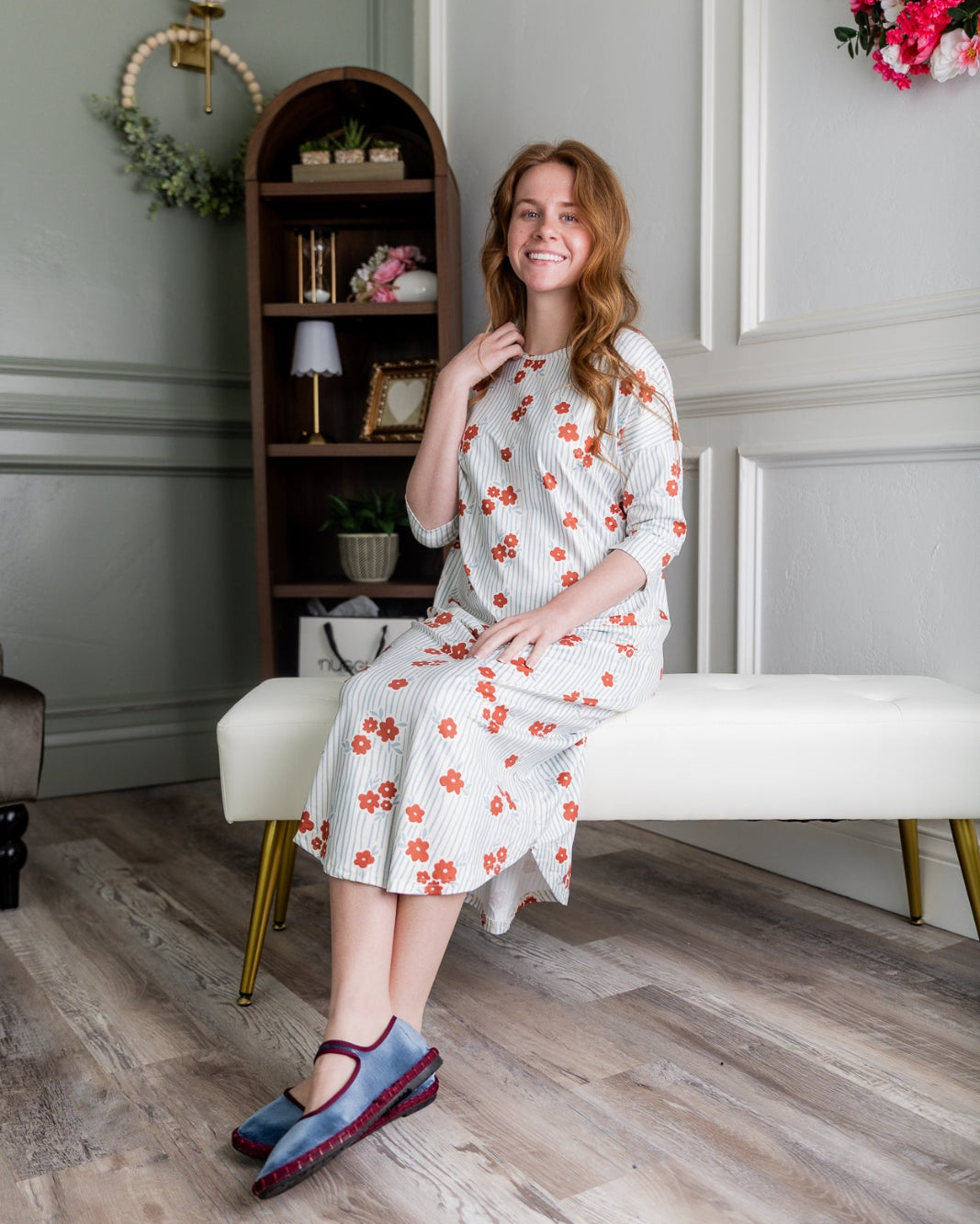 Model wearing the Nuggles® Heather Dress in Rosebud Pinstripe