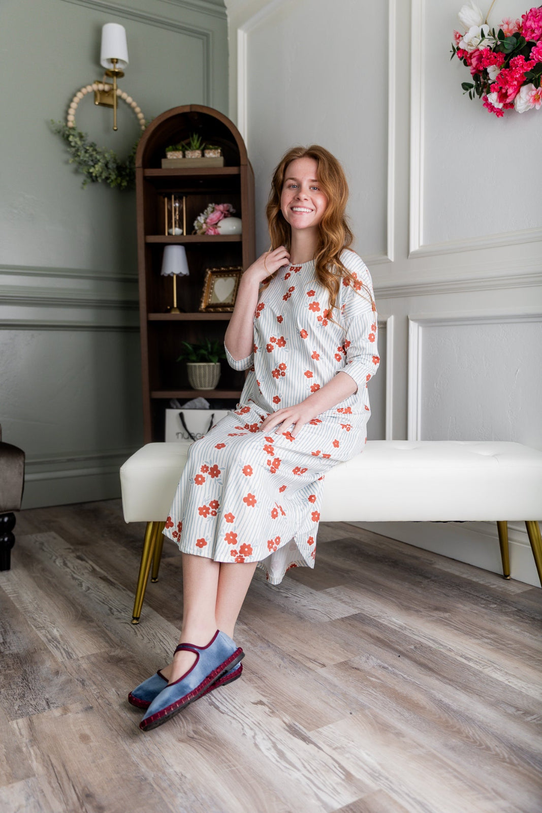 Model wearing the Nuggles® Heather Dress in Rosebud Pinstripe