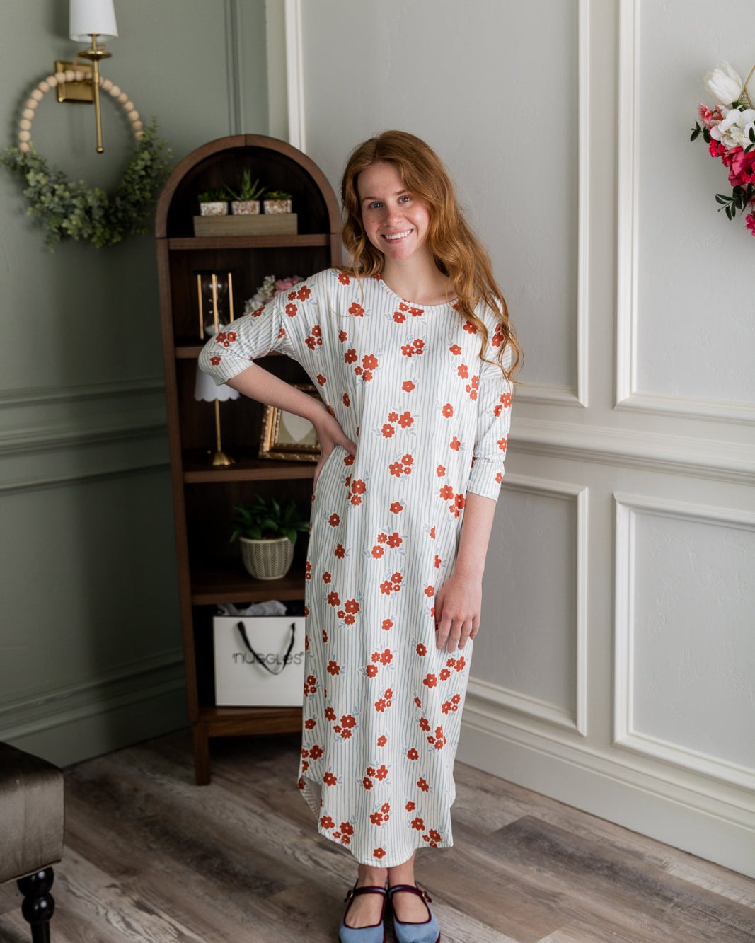 Model wearing the Nuggles® Heather Dress in Rosebud Pinstripe