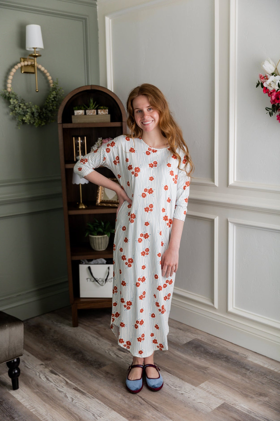 Model wearing the Nuggles® Heather Dress in Rosebud Pinstripe