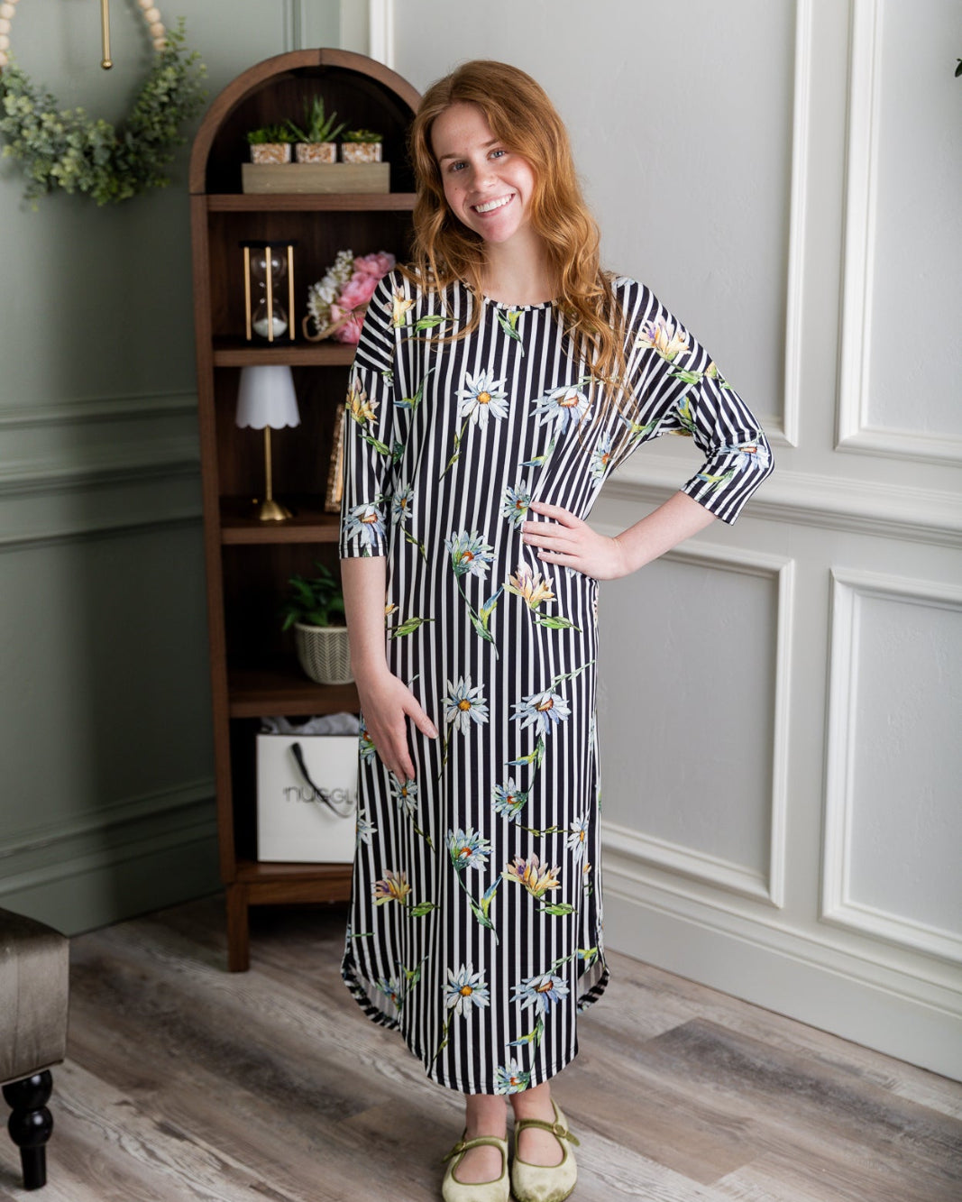 Model wearing the Nuggles® Heather Dress in Daisy Stripe