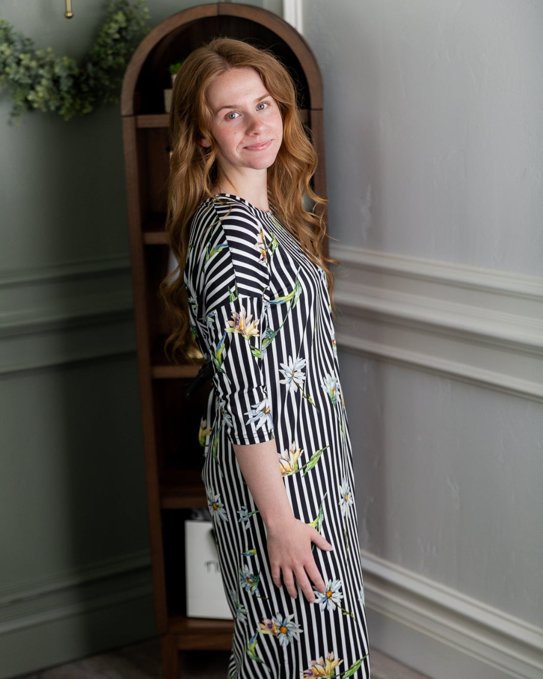 Model wearing the Nuggles® Heather Dress in Daisy Stripe