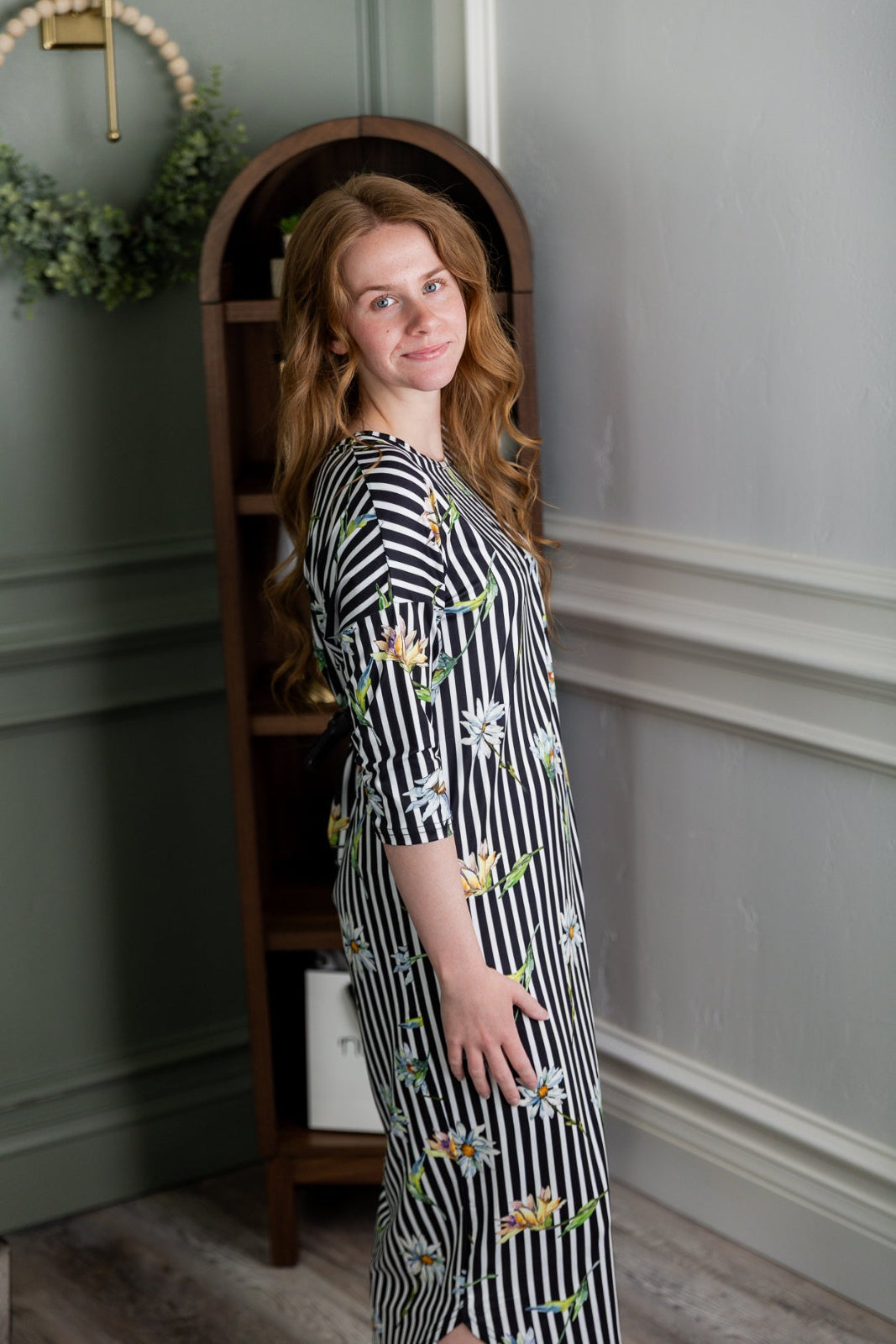 Model wearing the Nuggles® Heather Dress in Daisy Stripe