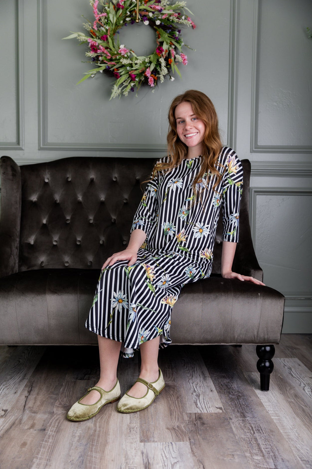 Model wearing the Nuggles® Heather Dress in Daisy Stripe