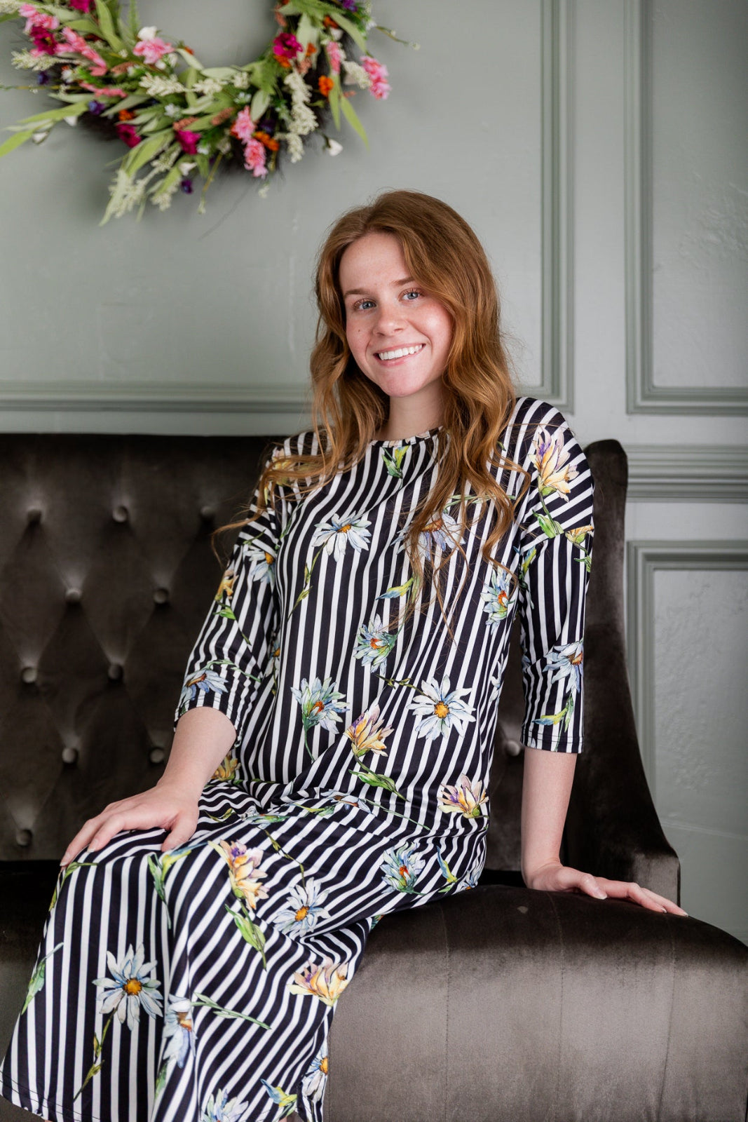 Model wearing the Nuggles® Heather Dress in Daisy Stripe