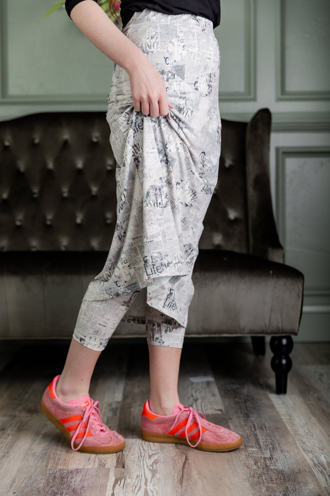 Model wearing Nuggles® 31" Sport Skirt in Whispering Headlines