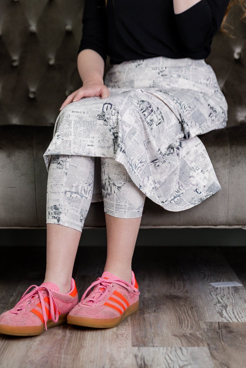 Model wearing Nuggles® 31" Sport Skirt in Whispering Headlines