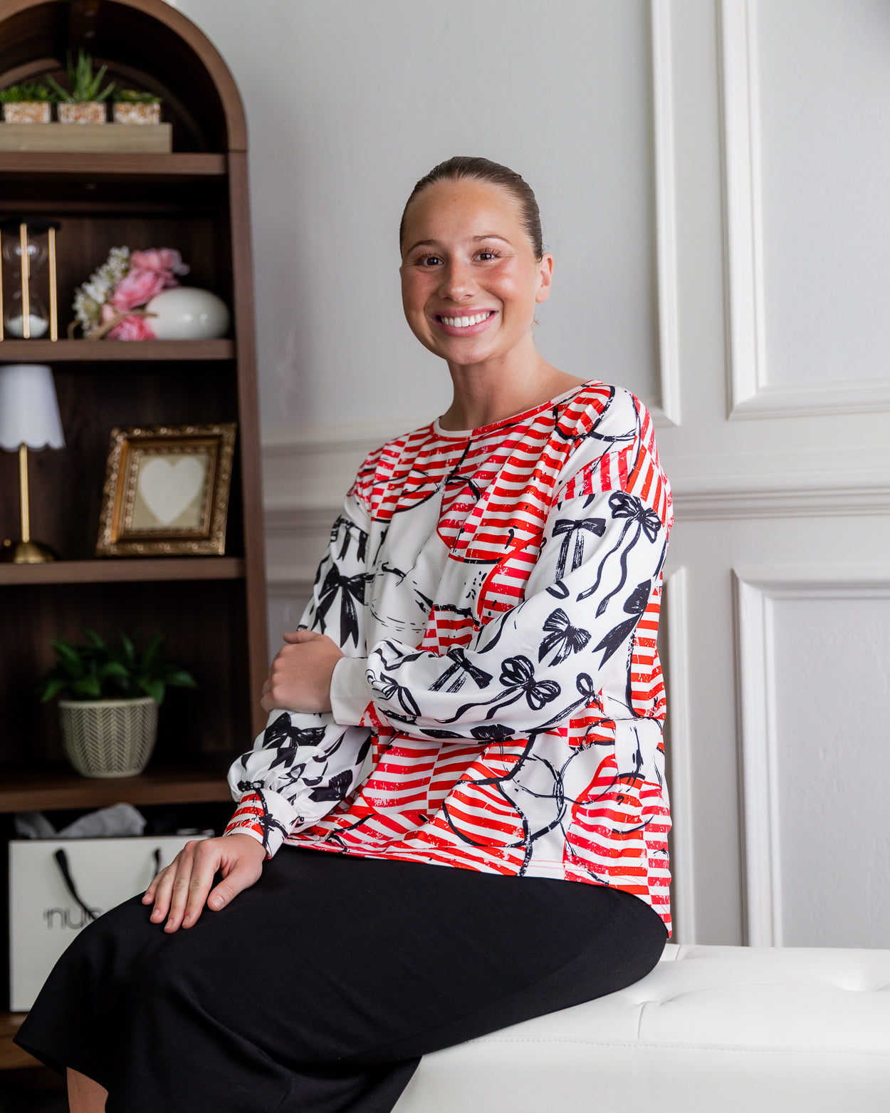 Model wearing Nuggles® Bryauna Top in Boardwalk Bows