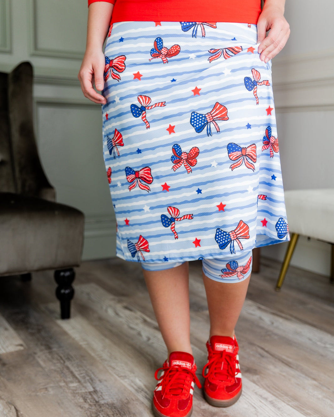 Model wearing the Nuggles® 31" All-Sport Skirt in Sky Ribbon Stripe