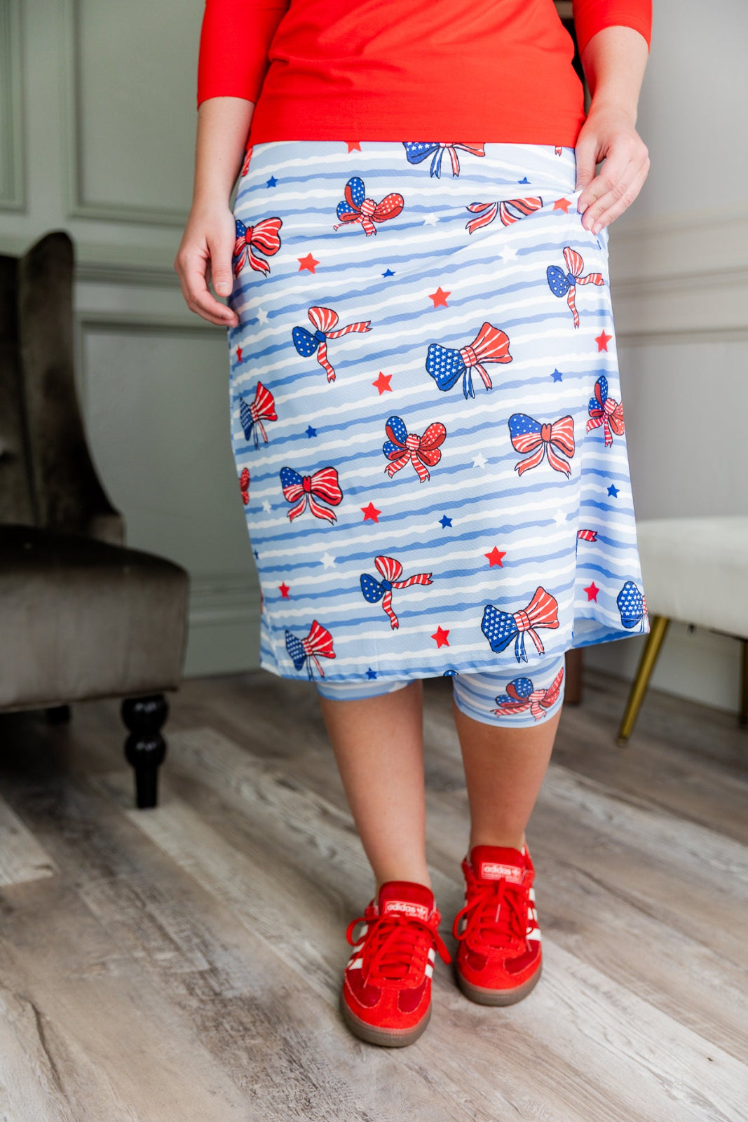 Model wearing the Nuggles® 31" All-Sport Skirt in Sky Ribbon Stripe