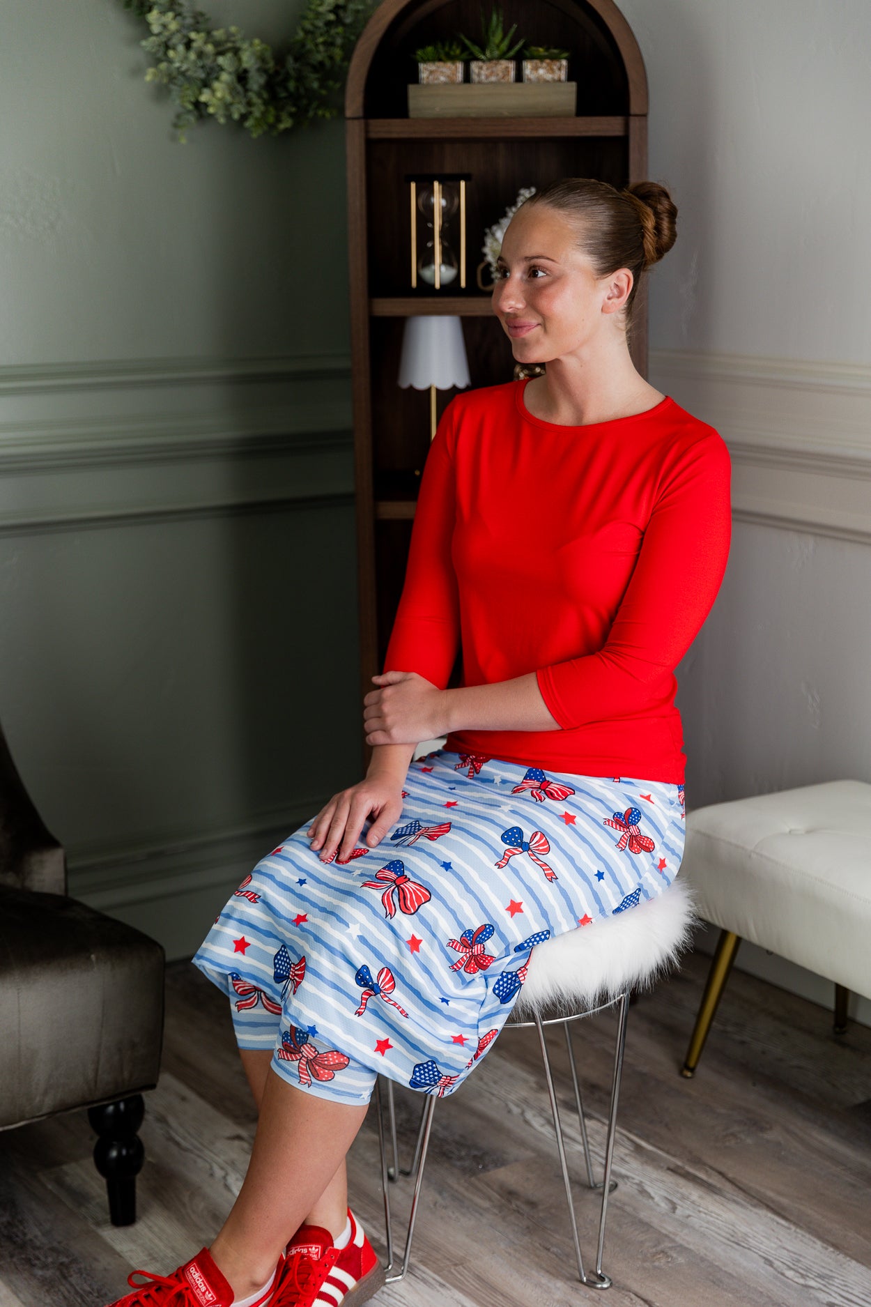 Model wearing Nuggles® 27" Sport Skirt in Sky Ribbon Stripe