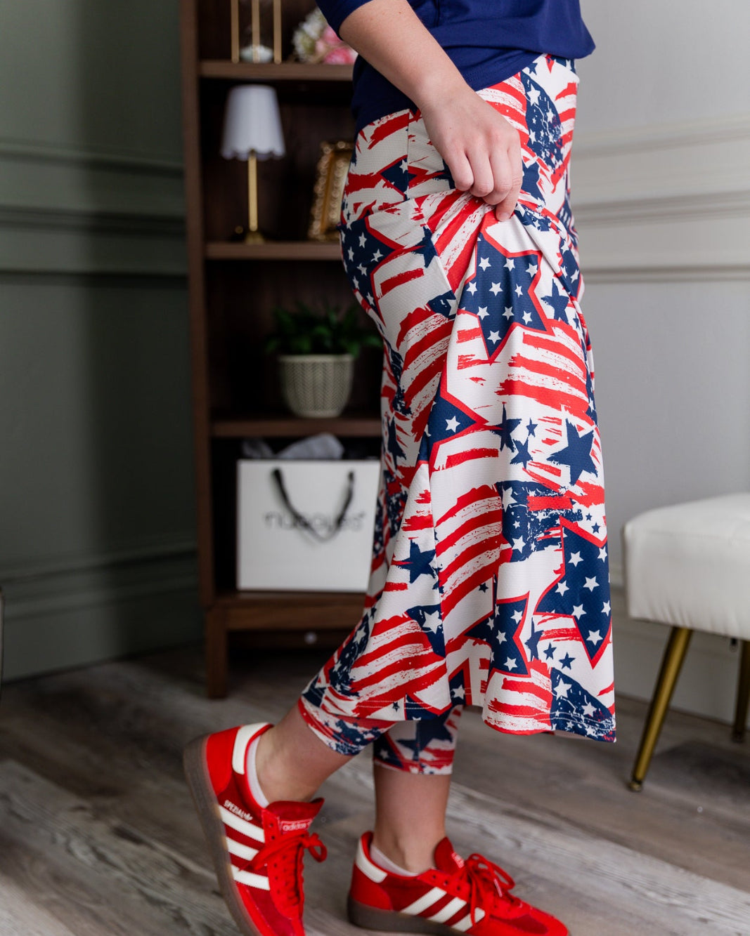 Model wearing the Nuggles® 31" All-Sport Skirt in Star-Spangled Parade