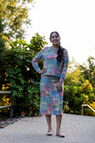 Nuggles® Iris two-piece set featuring soft knit midi skirt and crew-neck sweatshirt top