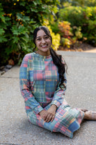 Nuggles® Iris two-piece set featuring soft knit midi skirt and crew-neck sweatshirt top