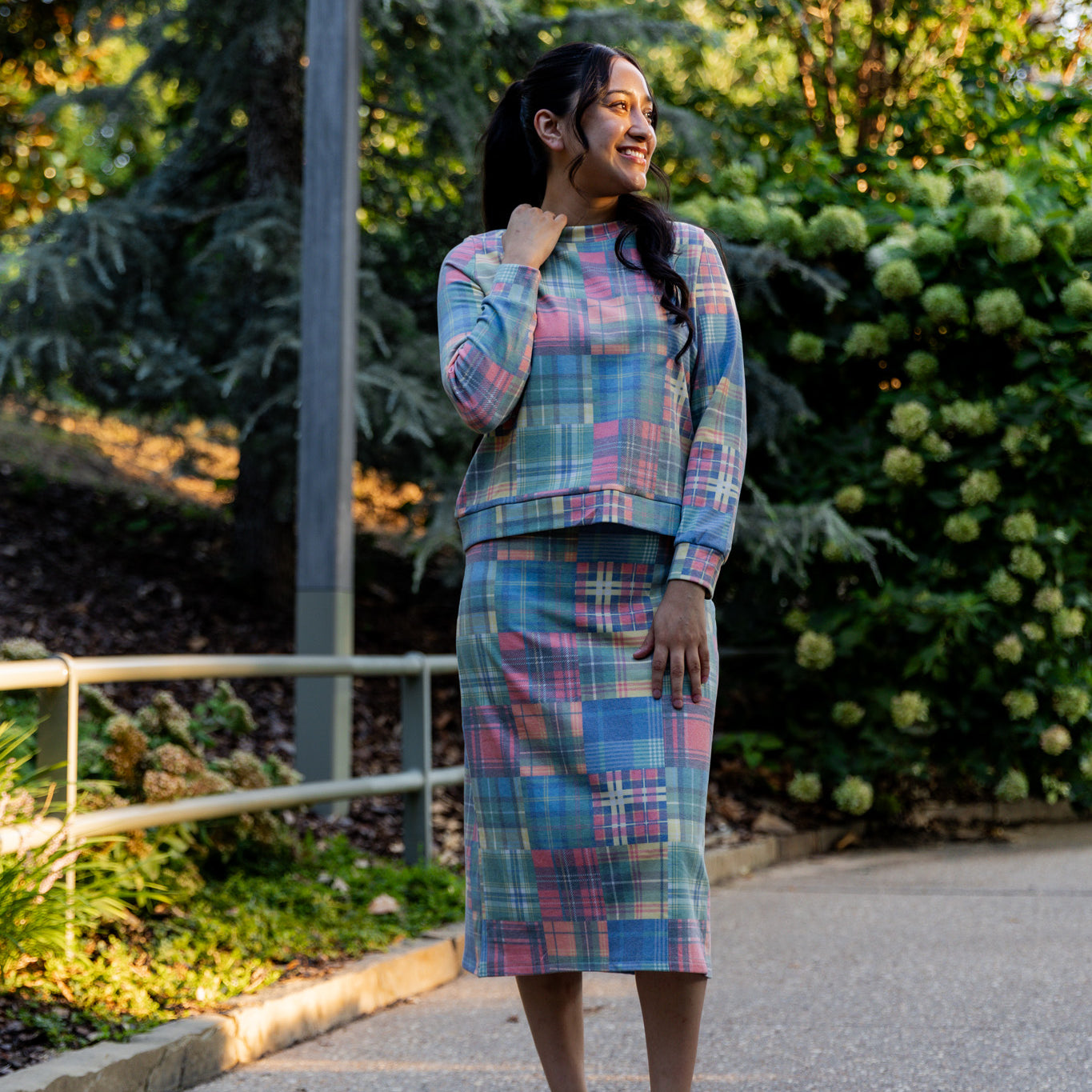 Nuggles® Iris two-piece set featuring soft knit midi skirt and crew-neck sweatshirt top
