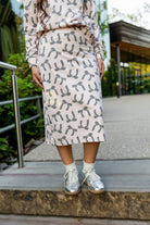 Nuggles® Iris two-piece set featuring soft knit midi skirt and crew-neck sweatshirt top