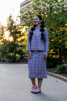 Nuggles® Iris two-piece set featuring soft knit midi skirt and crew-neck sweatshirt top